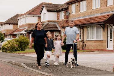 Lesley and Anth walking the dogs with two young girls