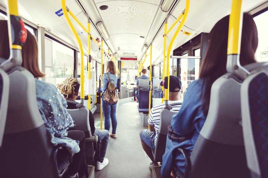 Interior of bus with people in 