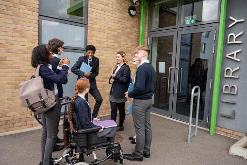 Disabled child arriving at school