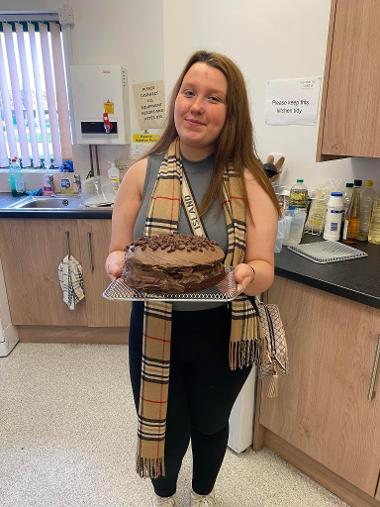 Young woman with cake