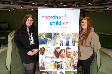 apprentices with banner