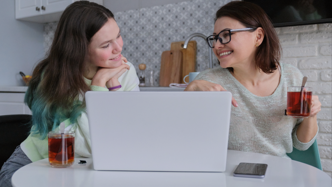 Woman and teen with laptop