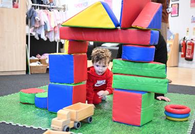 Little boy playing at Super Communicator 